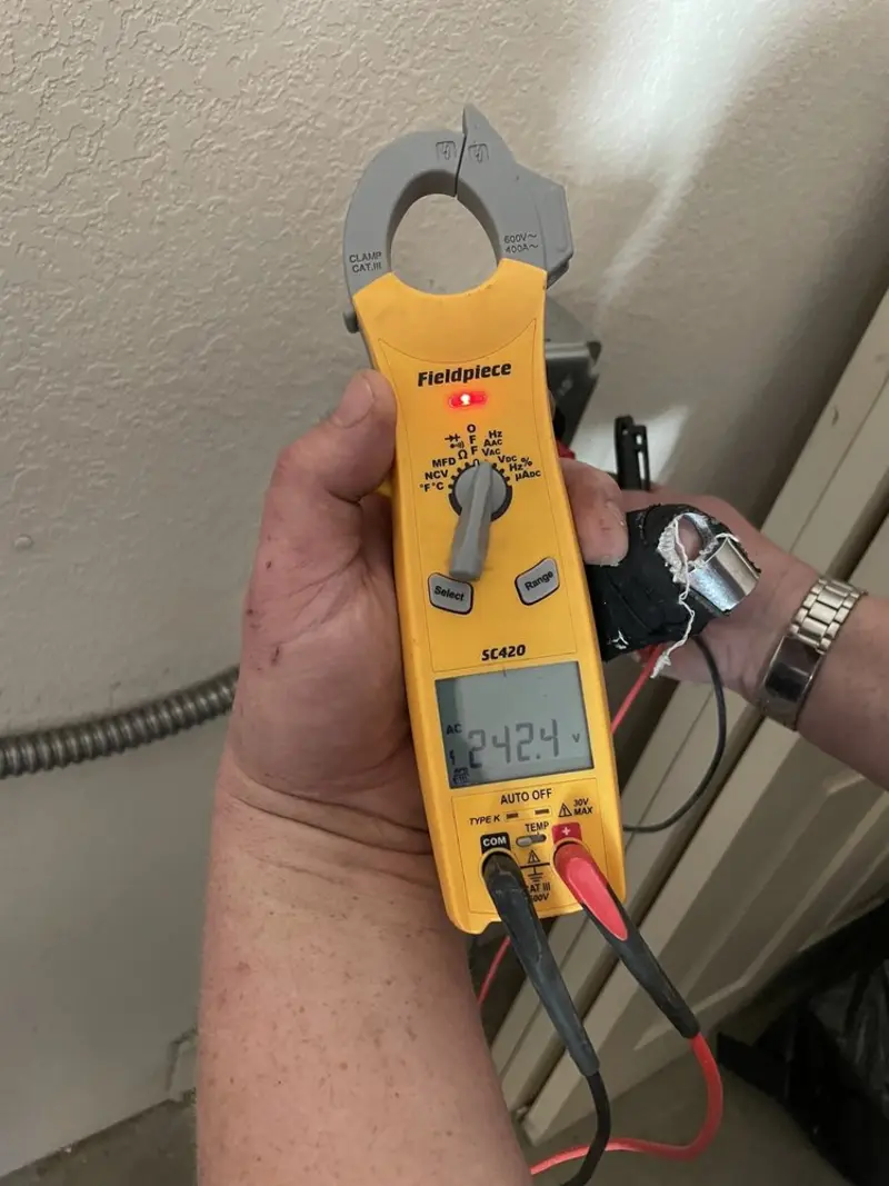 Voltage testing with clamp meter during Hot Tub / Pool Electrical Wiring in Baker